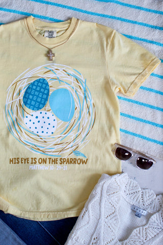 His Eye Is On The Sparrow Graphic Tee • Butter
